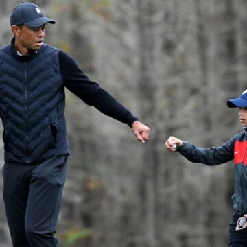 Tiger Woods warms up with his son Charlie, 11, and the similarities are striking